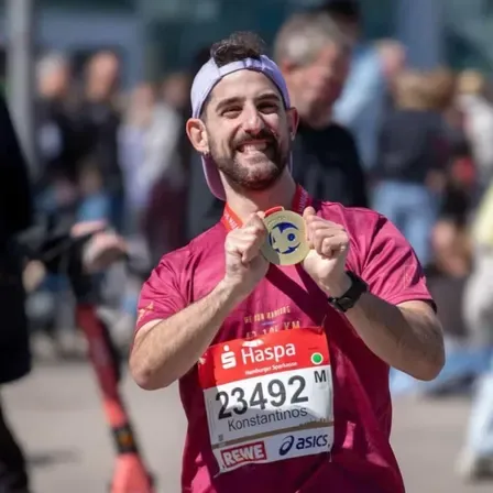 Konstantinos with his medal after a road race in Hamburg