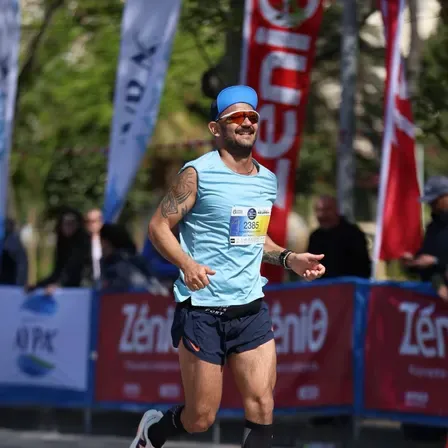 Spyros running a road race wearing bib number 2385
